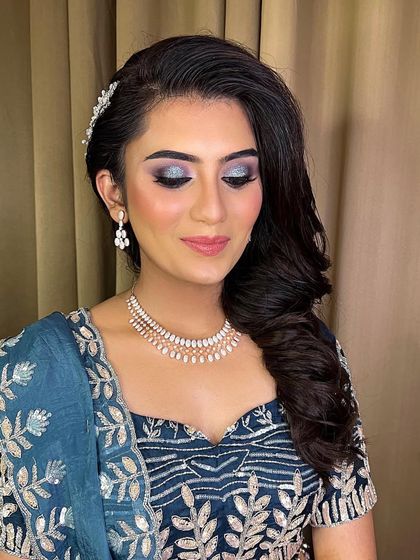 A close-up of the glittery eye makeup for this engagement look. The shimmer adds a touch of drama and glamour, perfect for an evening event.