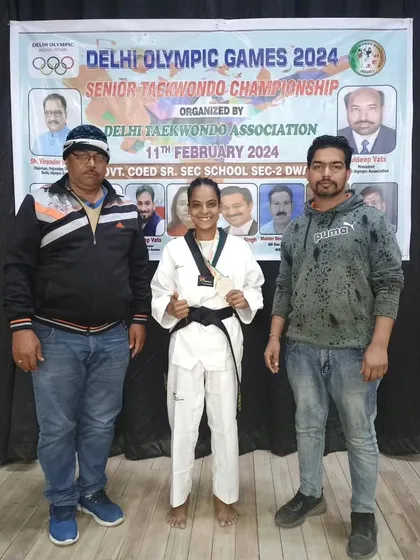 One of our senior female athletes with her silver medal at the Delhi Olympic Games. This achievement secured her a spot in the Khelo India league.
