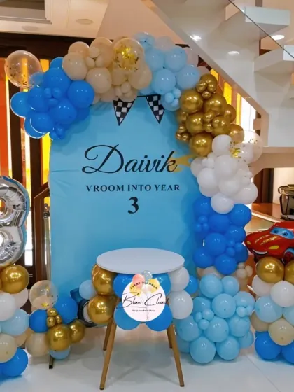 The complete car-themed birthday setup, including a cake table, for a fun and stylish celebration.