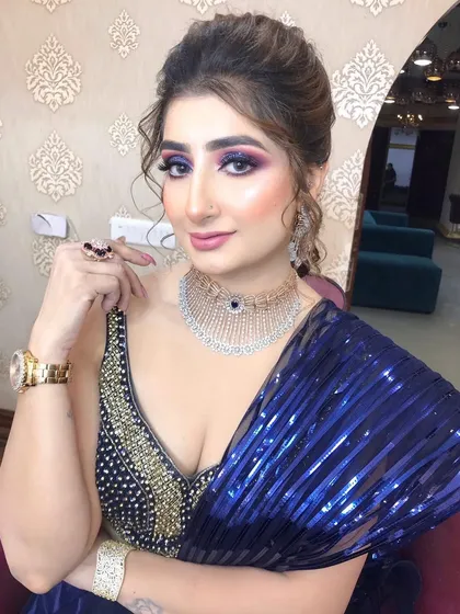 A close-up of the striking eye makeup and intricate jewellery, perfect for making an entrance.