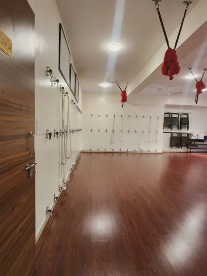 Another view of our spacious Manipura studio, equipped with wall ropes and aerial yoga hammocks. This versatile space allows for a wide range of practices, from grounding Hatha to playful aerial.