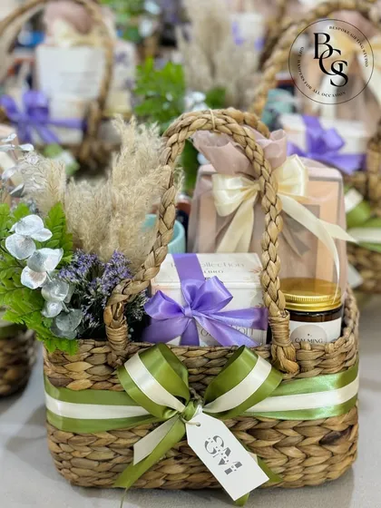 This gift basket, with its soft lavender and green colour palette, is a beautiful example of a housewarming or thank you gift. The dried florals and elegant ribbons add a touch of rustic charm.