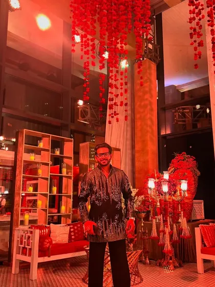 The scale of this private Diwali party was incredible, with stunning floral decorations hanging from the high ceiling. It was a truly grand affair.