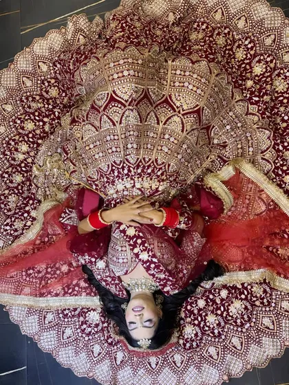 This is the kind of bridal magic I love to create. This shot captures the grandeur of a traditional wedding look, focusing on a flawless base, dramatic eyes, and a pose that makes the bride the absolute star of her day.