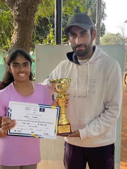 Manvi Gupta from our Gurgaon center poses with her coach after winning the AITA Championship Series U-16 tournament without dropping a single set.