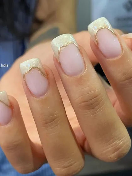A side view of the pearl thread and chrome French manicure, showing the clean lines and beautiful finish.