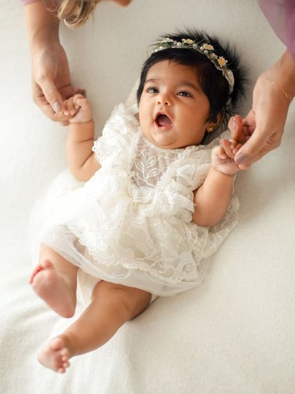 A happy, expressive moment from a baby girl. Capturing these little yawns and stretches adds so much personality to the gallery.