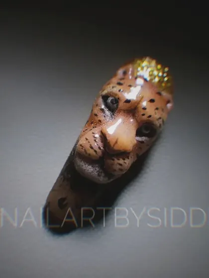 This hyper-realistic 3D leopard head is an example of the advanced sculptural techniques I teach. Learning this skill will help you create unique, high-impact nail art that stands out.