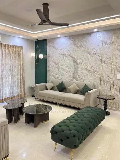 This living room set combines a beige channel-tufted sofa with a deep green braided bench and marble-topped nesting tables. The mix of textures and colors creates a rich, layered, and sophisticated look.