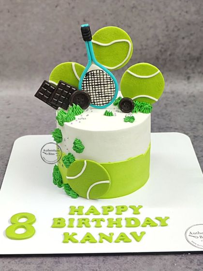 A fun tennis cake for an 8th birthday. This design features edible tennis balls and a racket, perfect for a young tennis lover.