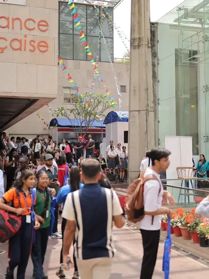 The entrance to our campus buzzing with energy during the annual Francophonie Mela. Students, families, and visitors gather, showing the scale and excitement of our cultural celebrations. It's a perfect example of the community spirit we foster.
