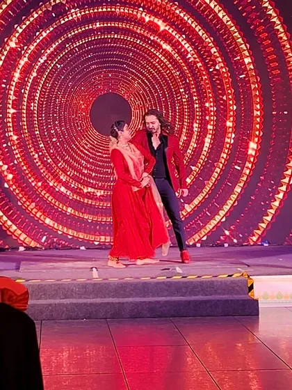 A slightly blurred action shot capturing the spin and flow of a duet performance.