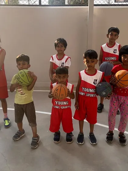 Ready to be a basketball star? Our young hoops team proudly shows off their basketballs after a great session. We focus on teaching the fundamentals of the game in a way that’s fun and builds teamwork from day one.