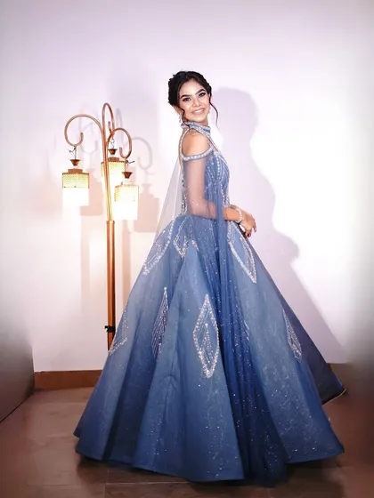 A smiling, happy shot in the blue gown, showing its beautiful movement.