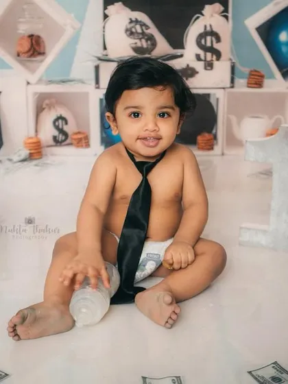 It's all business and play for this little boss. First birthday cake smashes are meant to be fun and messy, and this Boss Baby theme is a perfect example of how we can celebrate your baby's big milestone with lots of laughter.