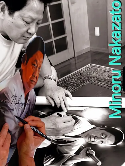 A creative image of Hanshi Minoru Nakazato signing a portrait. He is a living legend in the world of karate, and we are honored to be under his guidance.