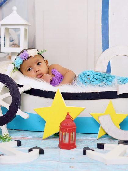 A wider view of the nautical setup, showing all the little details like anchors, lanterns, and stars that make the theme come alive.