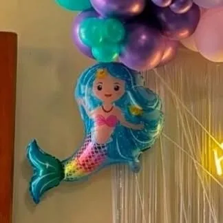 A close-up of a mermaid foil balloon, one of the many themed elements we use to bring a character party to life.