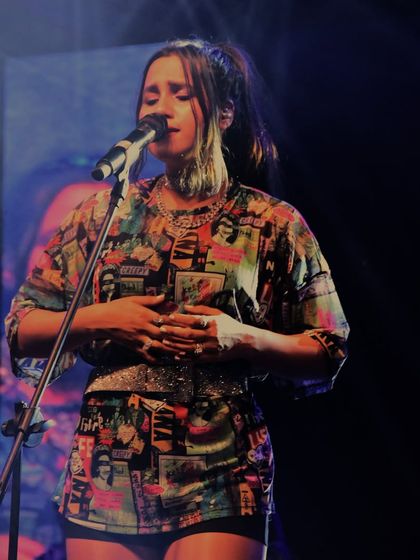 A soulful moment from Nikhita Gandhi's performance, showcasing her versatility as a live artist.