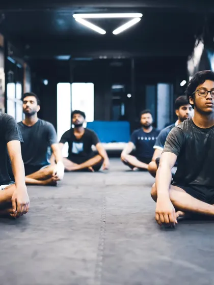 Students sit in meditation, finding their focus and calm after an intense training session.