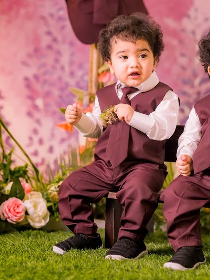 Dressed to impress in our pastel garden setting. This photo shows how our teepee and bench props can be used to create a lovely, coordinated portrait for two.