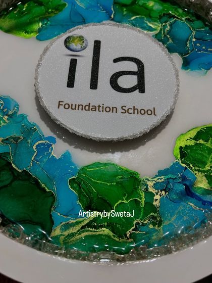 A close-up of the school's logo and the beautiful, flowing ink patterns.