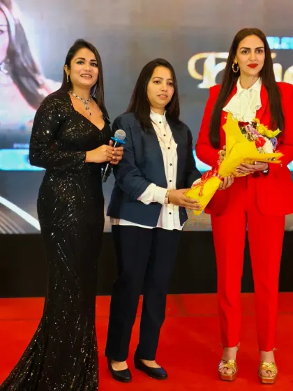 On stage with the powerful and stylish Esha Deol at the Bizzop Business Awards. I am confident in sharing the stage with celebrities and ensuring the event's flow is maintained.