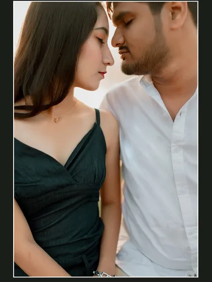 An intimate close-up portrait of a couple by the lake. This frame focuses purely on their connection, capturing the quiet and tender emotions shared between them.