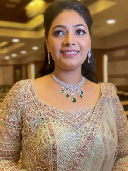 A happy and bright portrait. The soft smokey eyes and glowing skin are perfect for a sangeet, ensuring the bride looks her best while she celebrates.