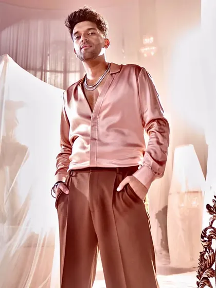 I designed this custom satin shirt for singer Guru Randhawa for his song 'Designer'. The fabric and fit were chosen to create a look of relaxed luxury.