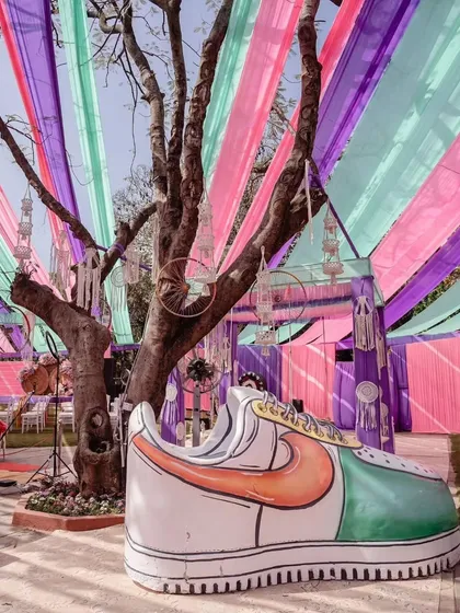 We love adding fun, oversized props to our themed events. This giant sneaker was a huge hit at our carnival Haldi, providing a unique and memorable photo opportunity for guests.
