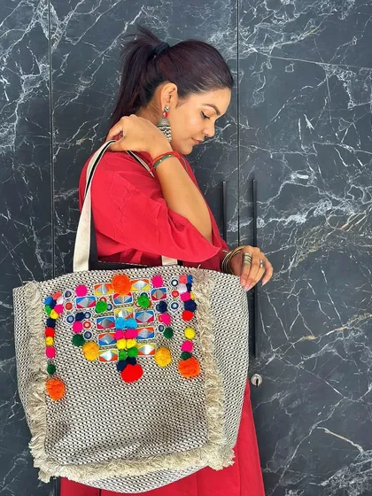 A side view showing how comfortably the tote sits on the shoulder. It's a large bag that makes a bold style statement.