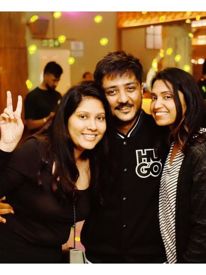 Friends posing for a photo, enjoying the fun atmosphere at Social.