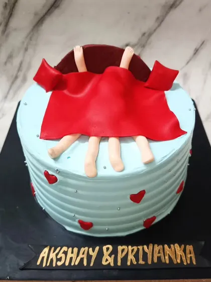 When love is in the air... and under the covers. 😉 A funny and naughty cake for a couple with a great sense of humor.