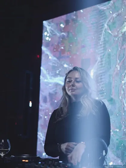 A moment of calm before the storm, standing in front of a cosmic visual display before my set begins.