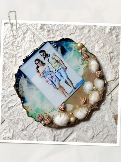 More views of the custom ocean themed photo frame. The layers of resin create a realistic wave effect, and the real seashells add a beautiful, tactile element to the piece.