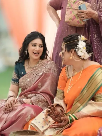 A candid moment between sisters. I love capturing these real moments. The makeup for the sister of the bride is designed to be elegant and long-lasting.