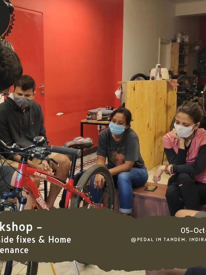 A group of riders learning together during a home maintenance workshop. The community atmosphere makes learning new skills less intimidating and more fun.