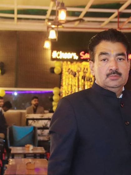 A portrait of a guest at an evening party. I take the time to get well-lit, clear photos of individuals.