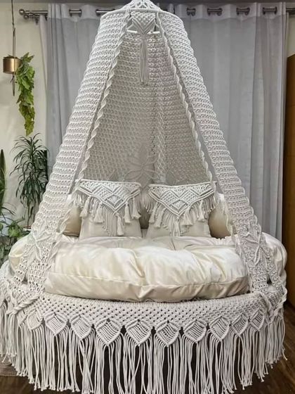 An all-white dual seater swing with matching white macrame cushions. This piece brings a feeling of pure luxury and comfort to your bedroom.