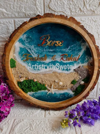 Your home's story begins at the door. This personalized ocean-themed nameplate, set in a rustic wood slice, combines the calm of the sea with the warmth of family, featuring real sand, shells, and beautiful 3D waves.
