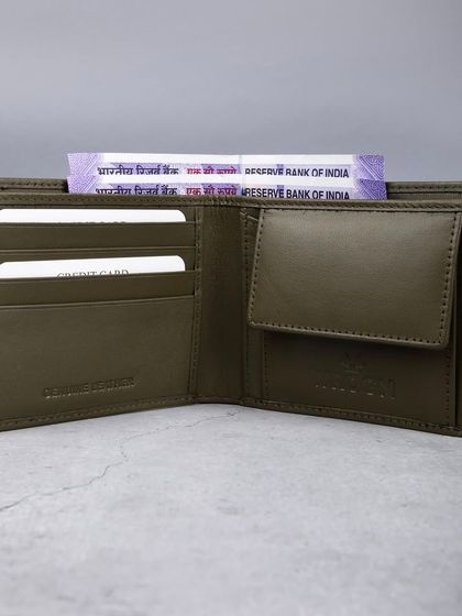 An open view of an olive green wallet, showing its coin pouch and card slots.