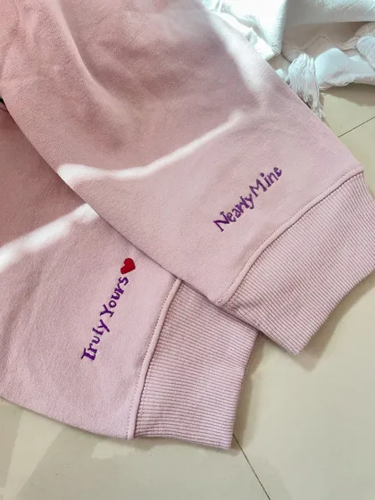 For those secret messages and inside jokes. This matching couple's hoodie set has custom text embroidered on the cuffs. It's a subtle, sweet way to feel connected.