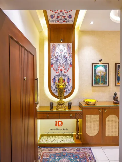 The entrance sets the tone for the entire home. For this traditional foyer, I designed a custom console with a beautiful backlit panel featuring peacock motifs, creating a warm and culturally rich welcome for family and guests.