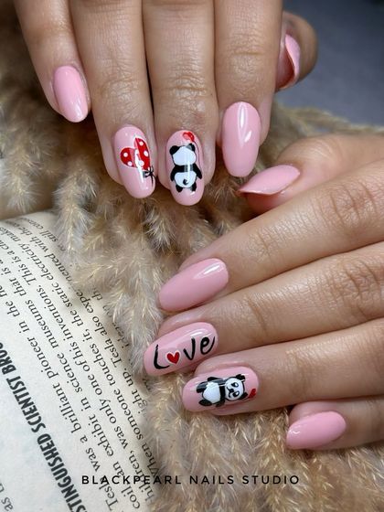 An adorable, custom-designed set for a panda lover. These nails feature a soft pink base with cute, hand-painted pandas and hearts, showing my ability to create personalized and playful art.