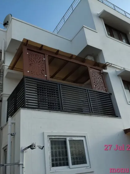 This balcony pergola demonstrates how to add both style and privacy. The structure features decorative CNC laser-cut panels and a translucent roof, creating a sheltered and elegant extension to the home.