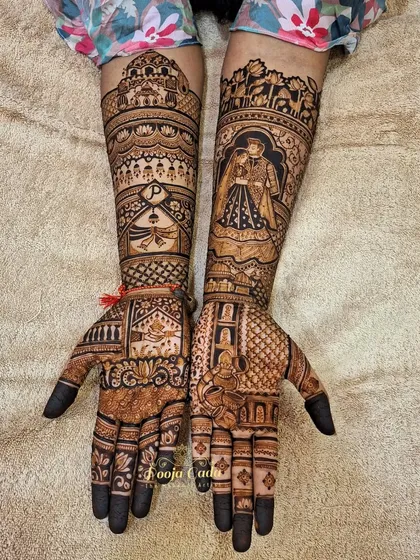 The full view of the custom design for the NRI bride, showing how personal elements like portraits and monograms are blended with traditional patterns.