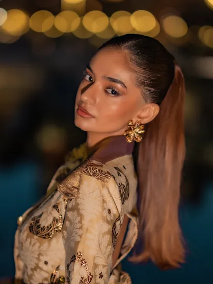 A close-up of the look I created for Anushka Sen at the Cannes Film Festival. The concept was inspired by an iced cortado for a Nespresso event, blending earthy tones with intricate details like these statement floral earrings and a sleek ponytail for a chic, international red carpet appearance.