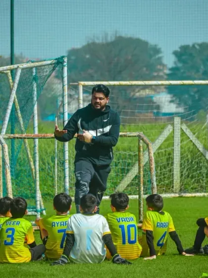 Great players are made with great guidance. I believe in hands-on coaching, and here I am giving a tactical briefing to our U-9 team during a tournament break.