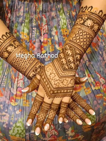 This full-coverage design features a V-shape on the back of the hands, filled with a dense net pattern. The arms include bands of elephants and lotuses.